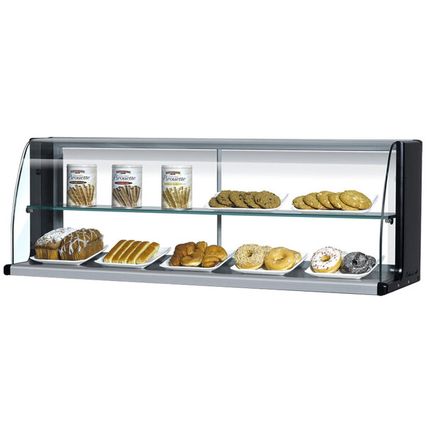 A Turbo Air black display case with a variety of pastries inside.