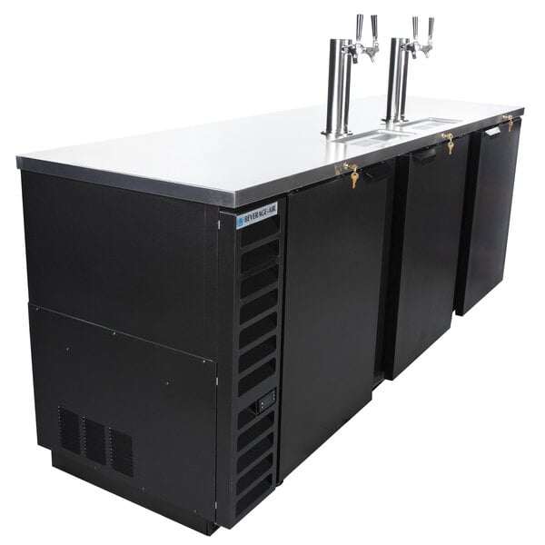 A black Beverage-Air beer dispenser with two taps on a counter.