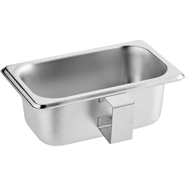 A stainless steel pan with a metal holder.