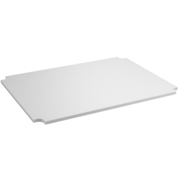 A white rectangular polyethylene cutting board insert with a hole.