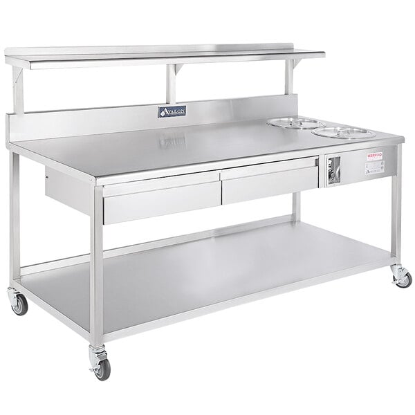An Avalon Manufacturing stainless steel work table with two drawers.