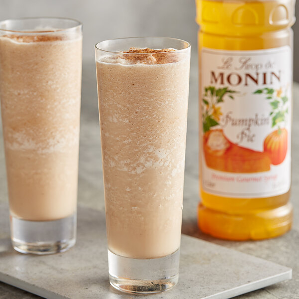 Two glasses of smoothies made with Monin Premium Pumpkin Pie Syrup.