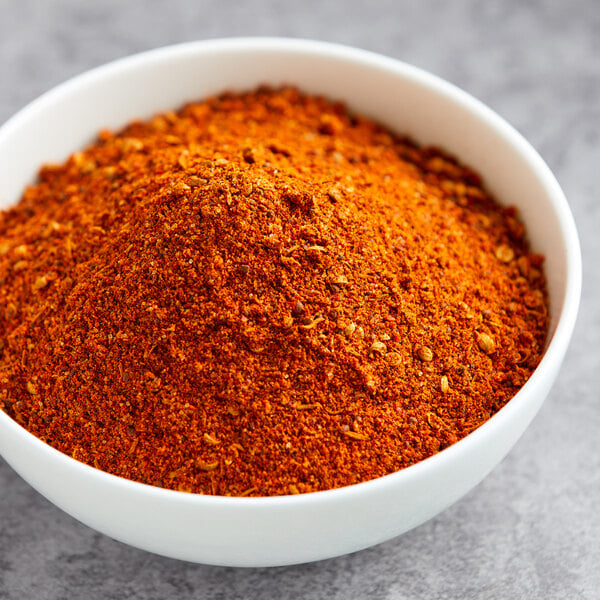 A bowl of Lawry's Memphis BBQ Rub on a gray surface.
