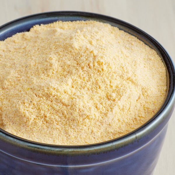 A bowl of Zatarain's Southern Style Fish Fri yellow powder.