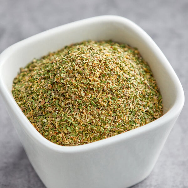A bowl of green and yellow Lawry's Salt-Free All Purpose Seasoning.