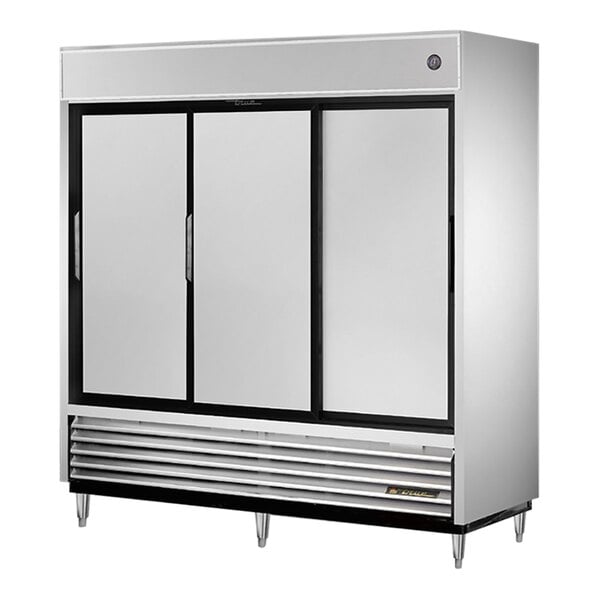 A True 3 section white reach-in refrigerator with sliding solid doors and black trim.