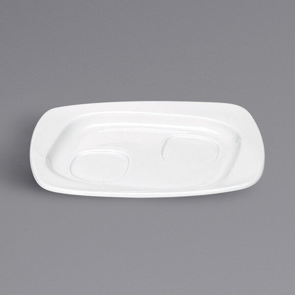 A bright white rectangular porcelain saucer with two oval indents.