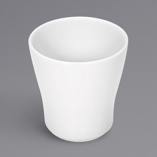 A Bauscher white porcelain tall bowl on a gray surface.