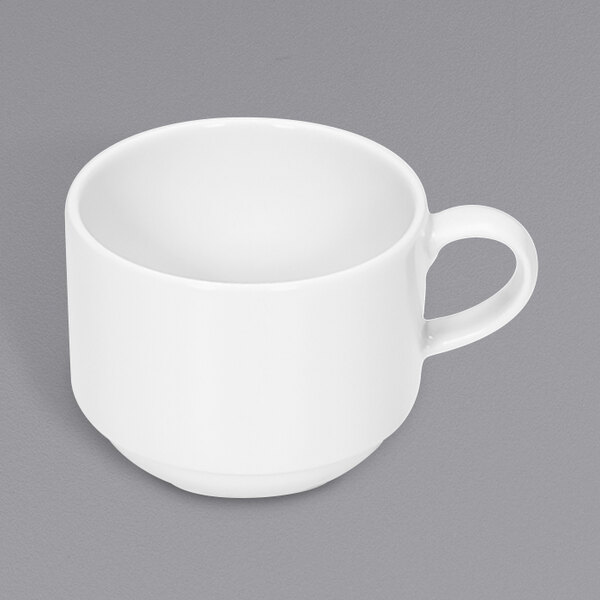 A Bauscher bright white stackable cup with a handle.