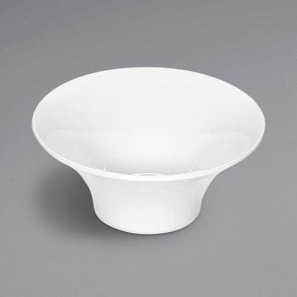 A Bauscher bright white round porcelain cream soup bowl on a gray surface.