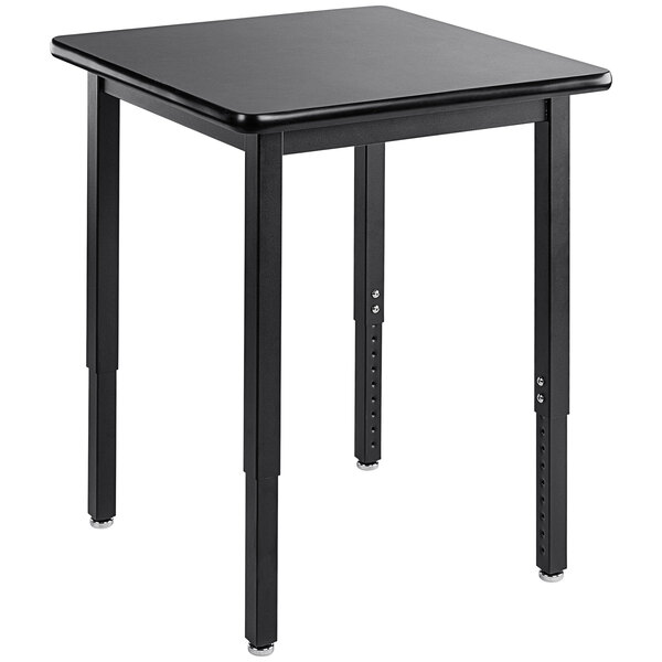 A black square National Public Seating science lab table with legs.