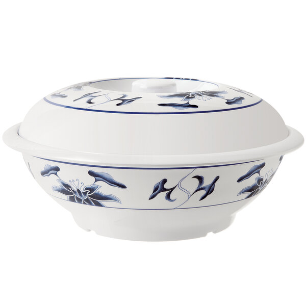 A white GET Water Lily melamine bowl with a blue and white design on it.