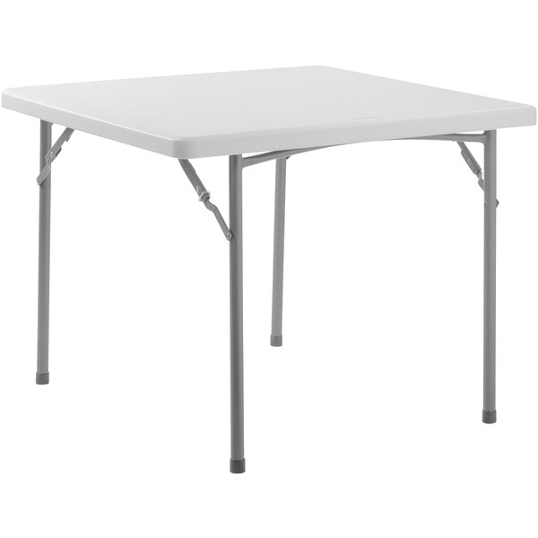 A speckled gray square plastic table with metal legs.