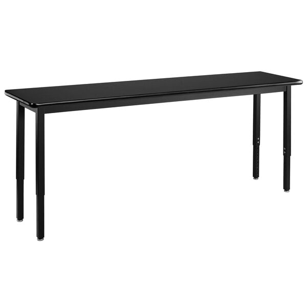 A black rectangular National Public Seating lab table with legs.