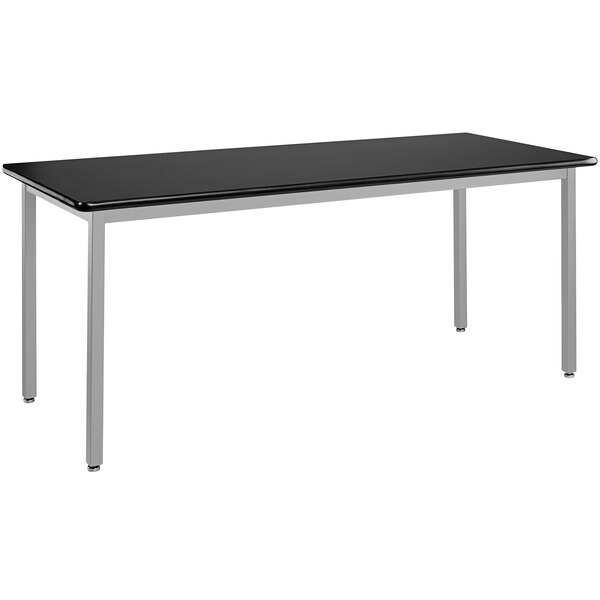 A black National Public Seating heavy-duty utility table with a gray metal frame and legs.