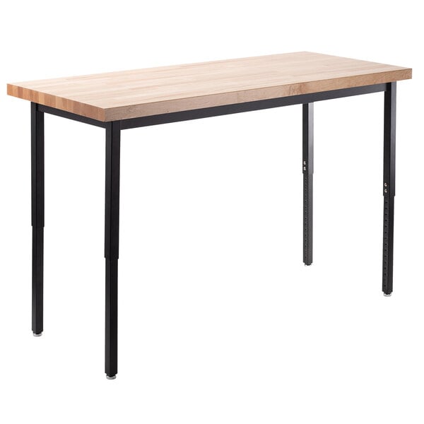 A National Public Seating heavy-duty utility table with black legs and a maple butcher block top.