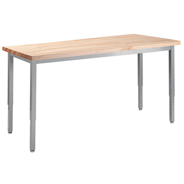 A National Public Seating utility table with a maple butcher block top and metal legs.