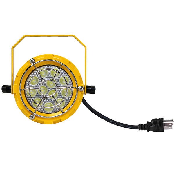 A yellow LED loading dock light with a wire.