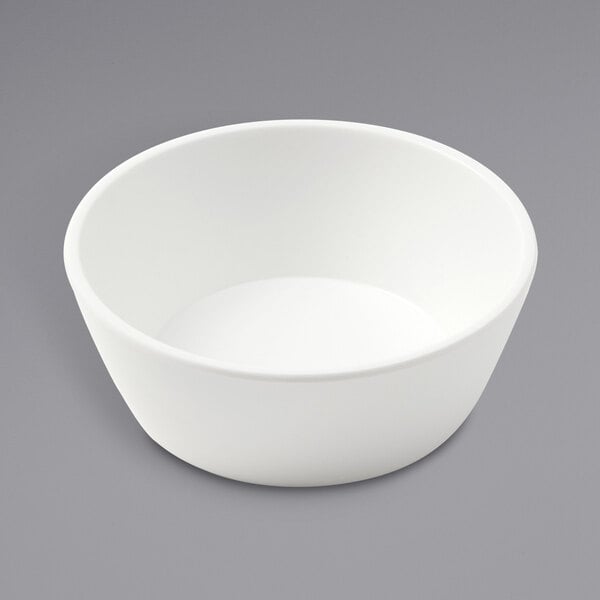 An American Metalcraft white melamine bowl on a gray surface.