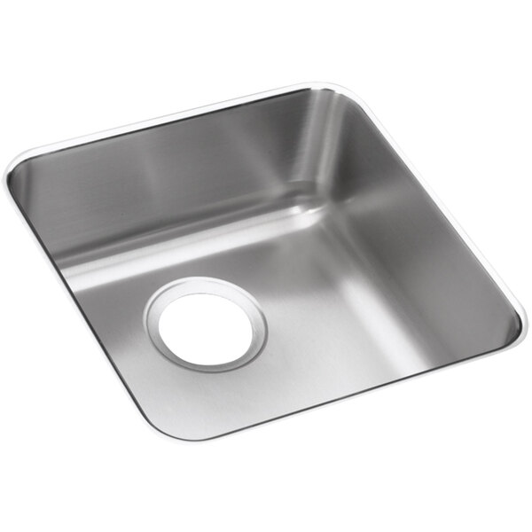 An Elkay Lusterstone stainless steel sink bowl undermounted in a counter.