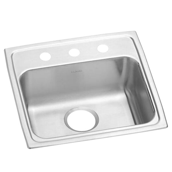 An Elkay stainless steel sink with three faucet holes on a counter.