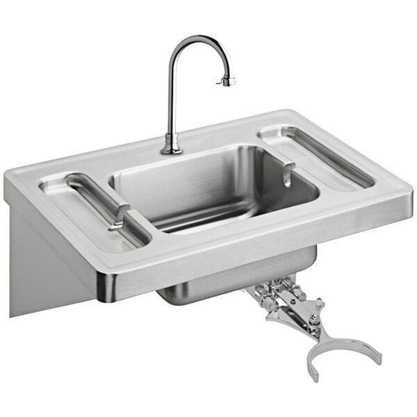 A stainless steel Elkay wall hung lavatory sink with knee control and faucet.