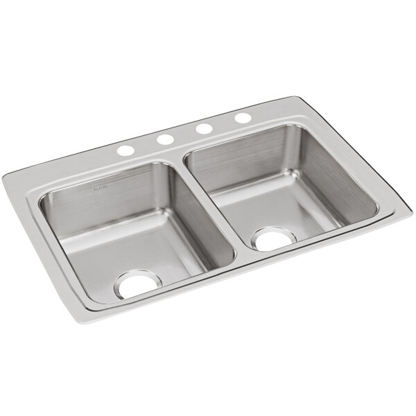 A stainless steel Elkay double sink with four faucet holes.