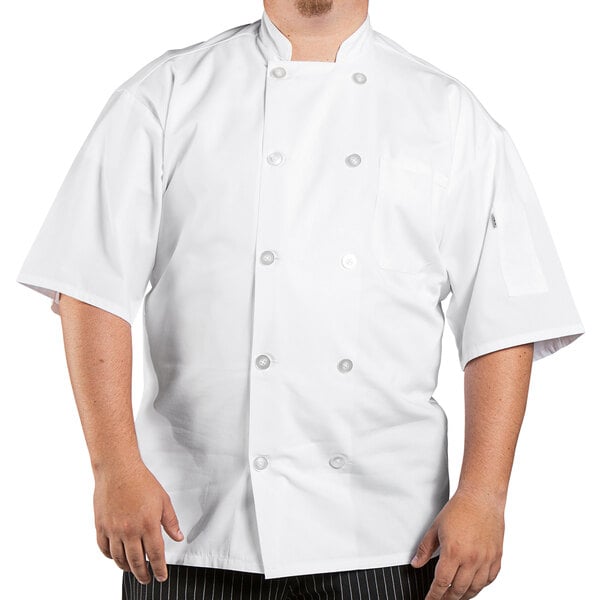 A man wearing a Uncommon Chef white short sleeve chef coat with mesh back.