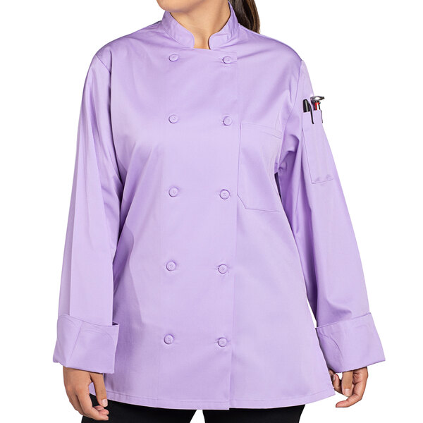 A woman wearing a lilac Uncommon Chef Tempest Pro Vent long sleeve chef coat with mesh back.