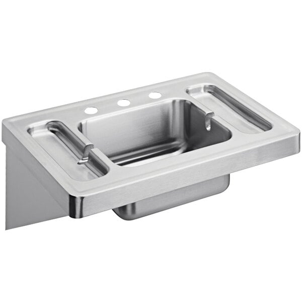 A stainless steel Elkay wall hung lavatory sink with three faucet holes.