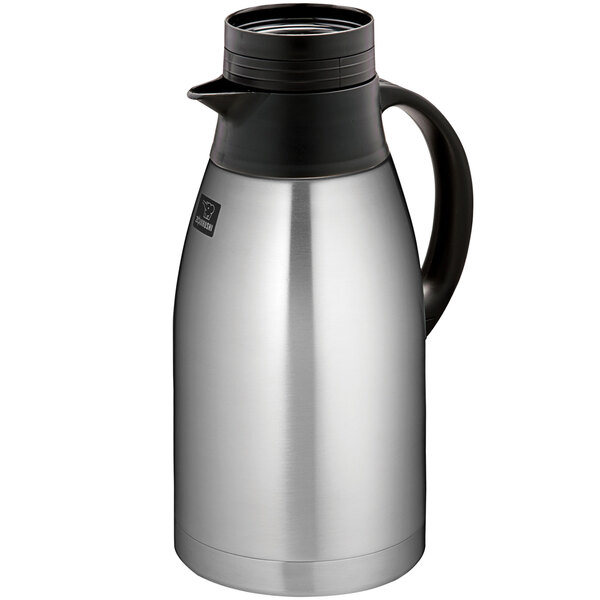 A Zojirushi stainless steel coffee carafe with a black lid and handle.