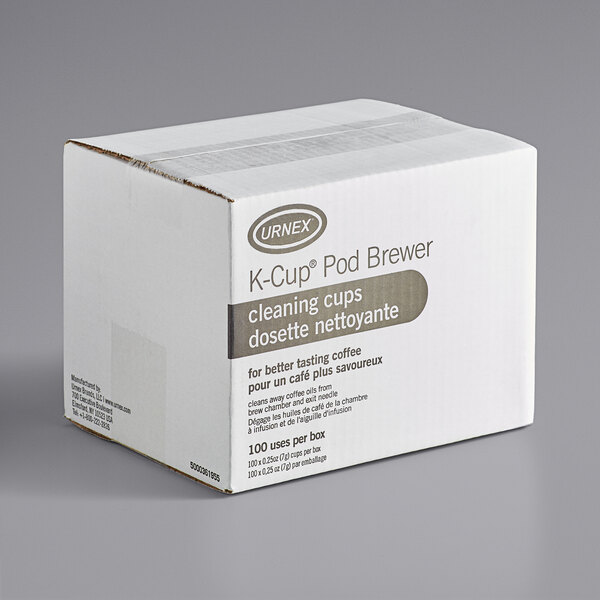 A white Urnex box with brown text for K-Cup single cup coffee brewer cleaning cups.