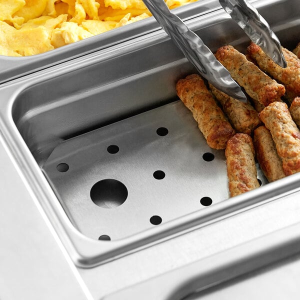 A stainless steel steam table pan false bottom with food in a metal container.