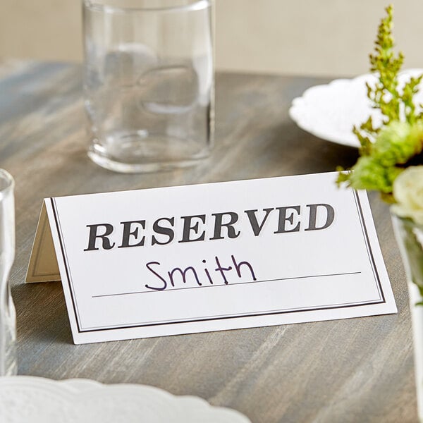 A table with a Choice "Reserved" table tent on it.