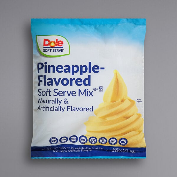 A package of Dole Pineapple Soft Serve Mix with yellow and white packaging.