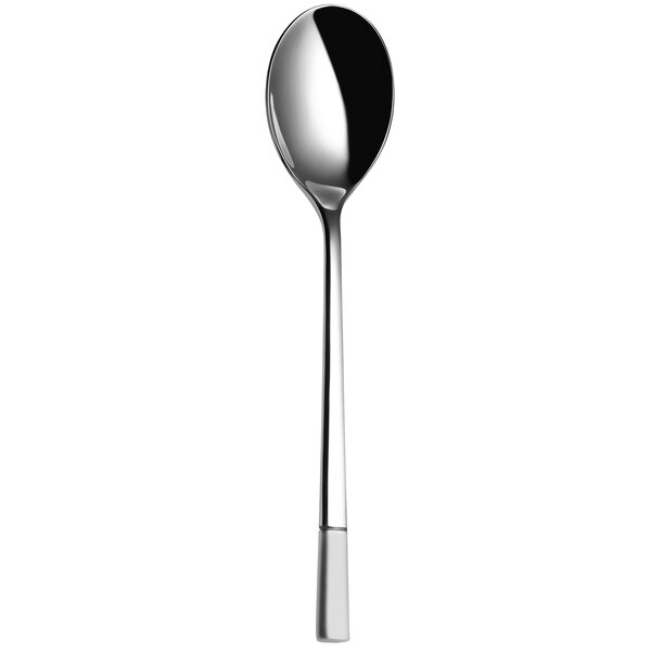 A silver tablespoon with a white handle.