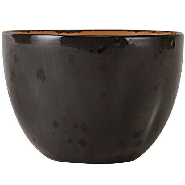 A black Tuxton bouillon cup with a brown rim.