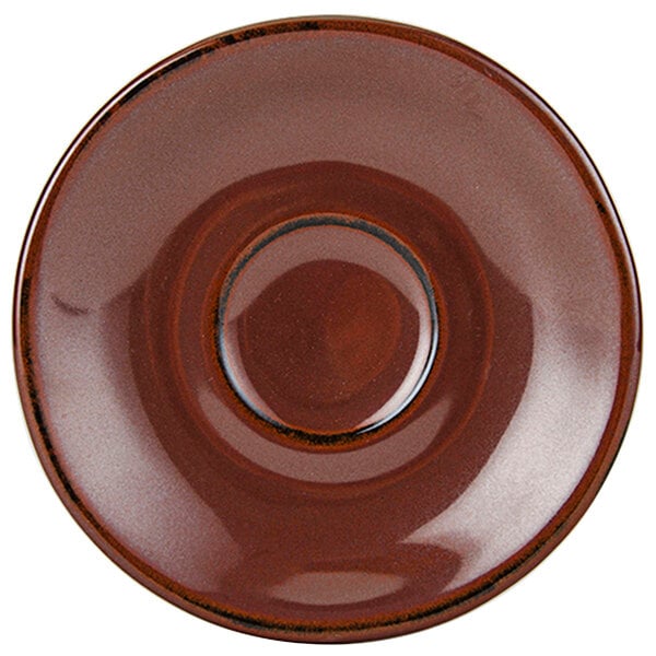 A brown Tuxton Artisan saucer with a circle in the middle.
