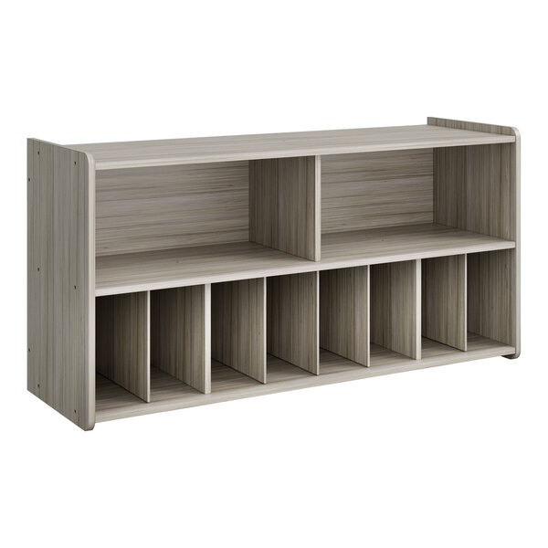 A Tot Mate shadow elm laminate wall storage unit with shelves.