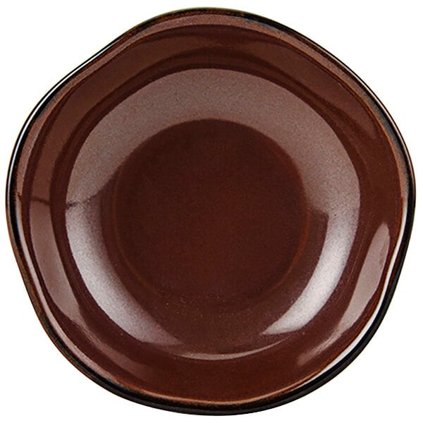 A brown Tuxton China bowl with a black rim.