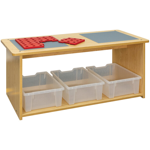 A maple laminate table with plastic bins and drawers.