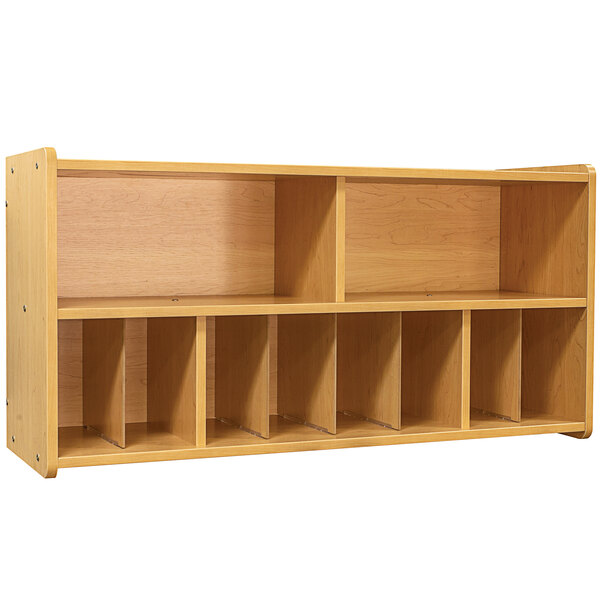 A maple laminate diaper wall storage unit with open shelves.
