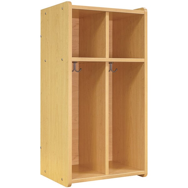 A maple wooden Tot Mate floor locker with two sections and two doors.