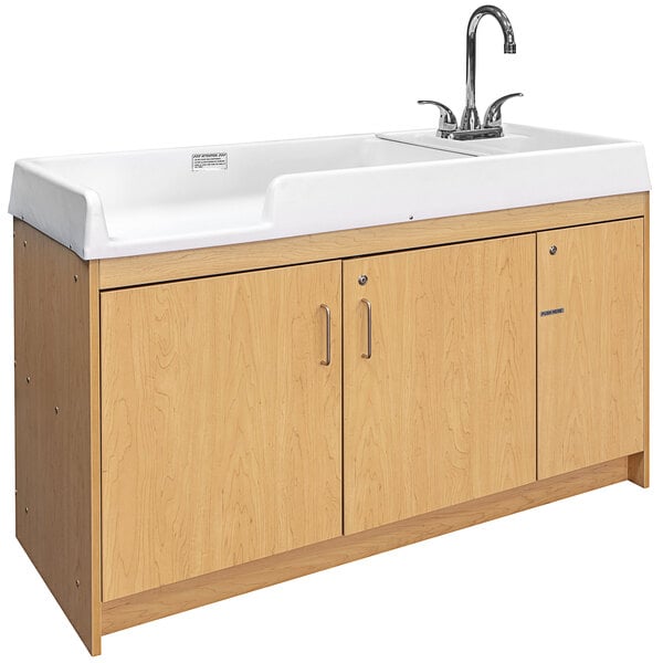 A maple changing table with a white sink on the right.