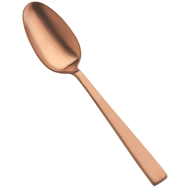 The handle of a Bon Chef matte rose gold soup/dessert spoon.