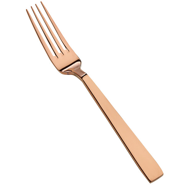 A close up of a Bon Chef rose gold dinner fork.