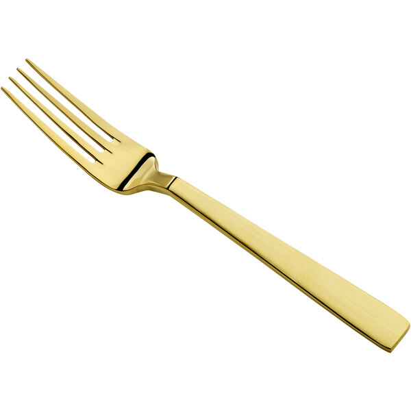 A close-up of a Bon Chef stainless steel dinner fork with a matte gold handle.