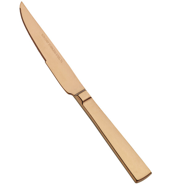 A Bon Chef stainless steel steak knife with a rose gold handle.