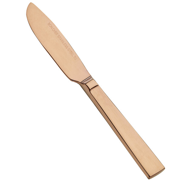 A close up of a Bon Chef stainless steel butter knife with a rose gold finish.