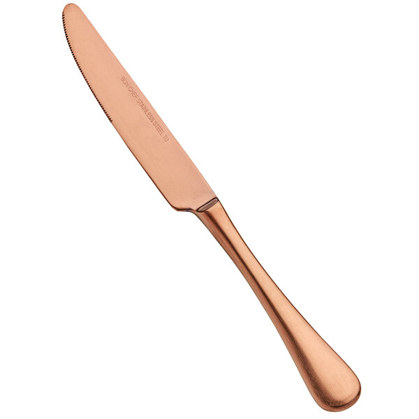 A Bon Chef stainless steel knife with a rose gold matte handle on a counter.